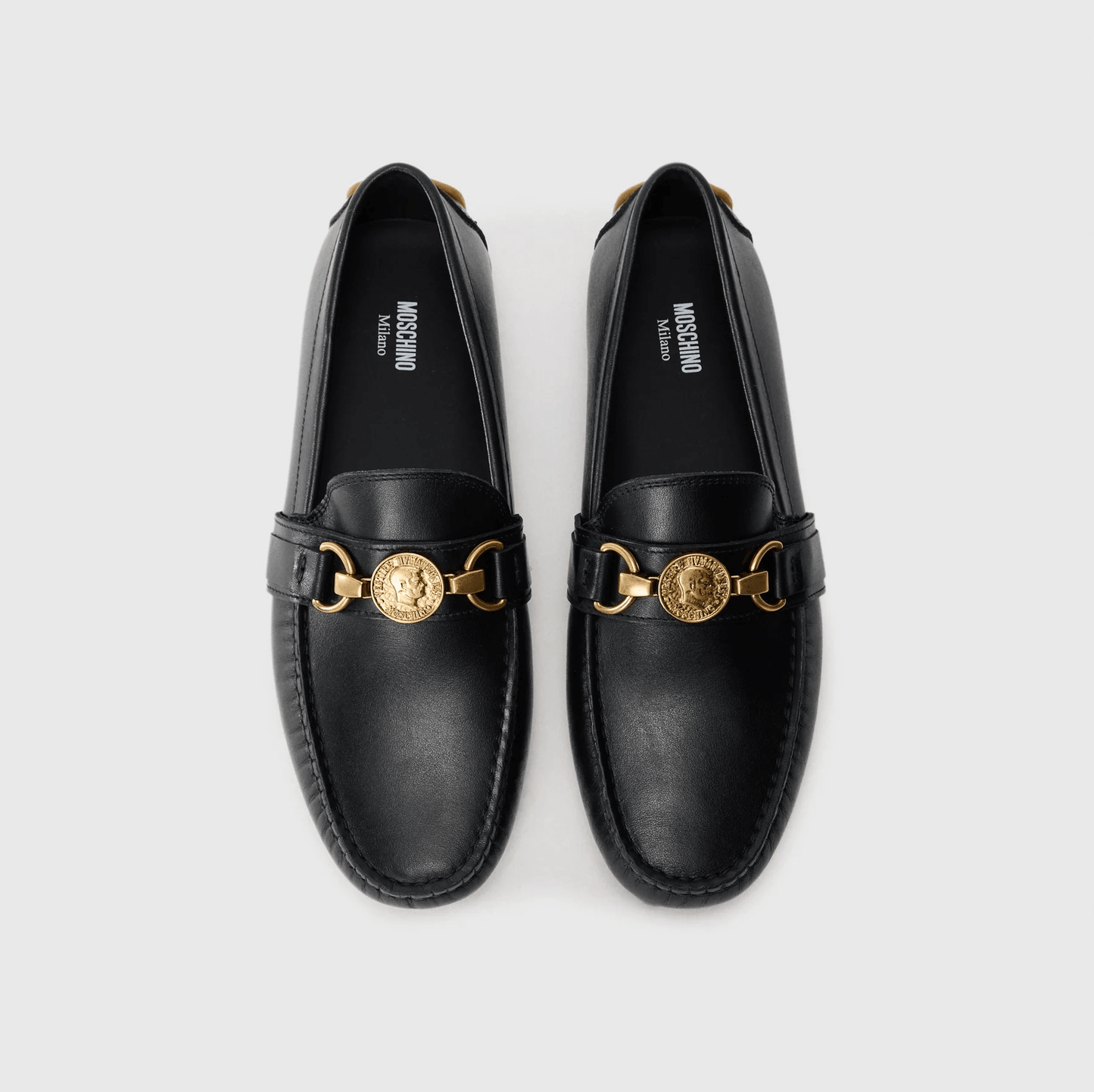 Moschino Mocassini pelle 210Z3L04D100 in black leather with gold detailing, stylish and comfortable loafers.