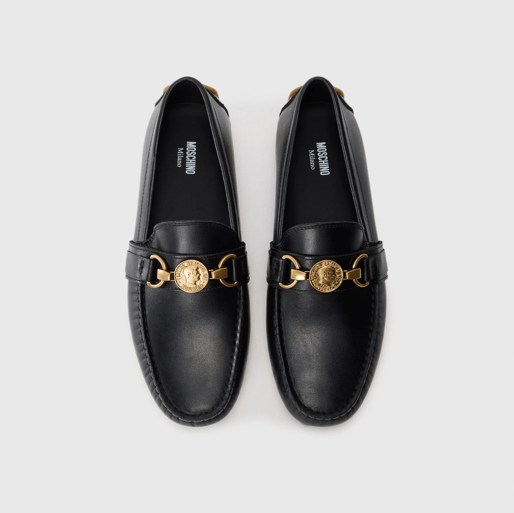 Moschino Mocassini pelle 210Z3L04D100 in black leather with gold detailing, stylish and comfortable loafers.